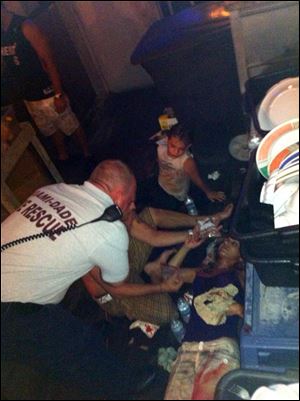Victims of a deck collapse  at Shuckers Bar & Grill in Miami are treated by Miami-Dade first responders.