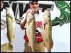  Kevin O'Malley of Pennsylvania shows off two of the five walleye he caught on the first day of the Cabela's National Walleye Tour event on Lake Erie.