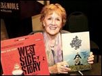  Marni Nixon holds album covers from ‘West Side Story’ and ‘Sound of Music, two of the productions on which she worked.