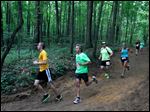  Runners make their way through Wildwood Metropark's trails.
