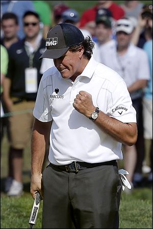Phil Mickelson pumps his fist after sinking a putt on the sixth hole in the third round of the U.S. Open at Merion Golf Club in Pennsylvania. Mickelson has five runner-up finishes at the U.S. Open but could break that streak today. He has won five major championships with the most recent coming at the 2010 Masters.