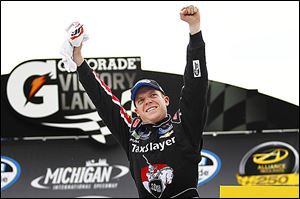 Regan Smith celebrates winning the Nationwide Alliance Truck Parts 250 at MIS, his second victory of the year.