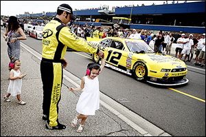 Sam Hornish, Jr. dances with his daughter Addison, 5, before the Nationwide race at Michigan International Speedway. Car problems caused Hornish to finish 32nd in the 39-car field.