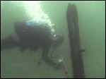  In this October 2012 image from video provided by David J. Ruck, diver Tom Kucharsky passes timbers protruding from the bottom of Lake Michigan.