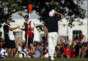 Justin Rose reacts after sinking a putt on the 18th hole during the fourth and final round of the U.S. Open on Sunday at Merion Golf Club in Ardmore, Pa. Rose won the U.S. Open, beating Jason Day and Phil Mickelson by two strokes.