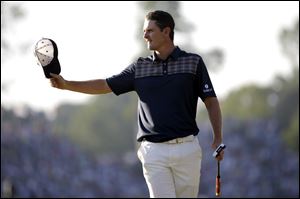 Justin Rose reacts after a putt on the 18th hole at the U.S. Open. He shot a 70 in the final round to win his first major championship.