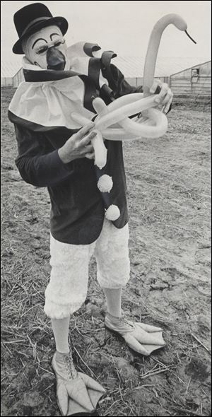 Eugene Curtis, as Quacky the Duck Clown, fashions a balloon sculpture in 1969 during a 50-year career.