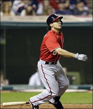 Washington Nationals' Anthony Rendon watches his ball after hitting a solo home run off Cleveland Indians relief pitcher Vinnie Pestano in the ninth inning.
