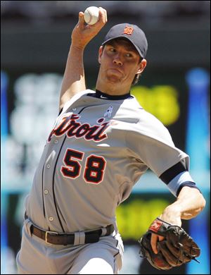 Detroit Tigers starting pitcher Doug Fister (58) throws against the Minnesota Twins in Minneapolis.