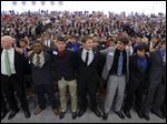 Buckeye Boys State participants sing a final song as they end their ecumenical church service and graduation ceremony at Bowling Green State University on Sunday.