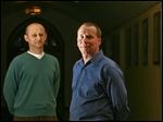  UT professors Oleg Smirnov, left, and David Black project Toledo’s 2013 income tax collections to top out at $160.81 mil­lion.