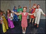  Lindsey Denham rehearses with the cast of ‘Joseph and the Amaz­ing Tech­ni­color Dream­coat,’ which will be presented by the Perrysburg Musical Theatre Company. Ms.  Denham will be the narrator.