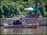  FBI personnel and a Coast Guard boat conduct another search in the Maumee River on Monday for Elaina Steinfurth, who has been missing for two weeks. 