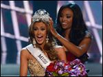  Miss Connecticut Erin Brady is crowned the winner of the Miss USA 2013 pageant by Nana Meriwether, Sunday, in Las Vegas.