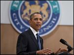  President Barack Obama gestures during a speech at the Belfast Waterfront Hall today in Belfast, Northern Ireland. 