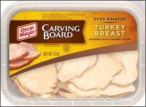 A package of Oscar Mayer Carving Board Turkey Breast shows natural-looking cuts.  Kraft Foods spent more than two years to develop the uneven cutting process.