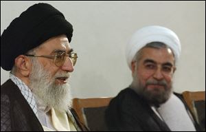 Supreme leader Ayatollah Ali Khamenei, left, speaks during his meeting with President-elect Hasan Rowhani, right, in Tehran, Iran, Sunday.