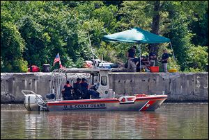 FBI personnel and a Coast Guard boat conduct another search in the Maumee River on Monday for Elaina Steinfurth, who has been missing for two weeks. 