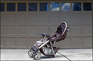The damaged stroller at Sandra Vollmar's home serves as a reminder that the driver involved has not yet been caught.