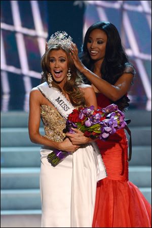 Miss Connecticut Erin Brady is crowned the winner of the Miss USA 2013 pageant by Nana Meriwether, Sunday, in Las Vegas.