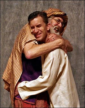 Doug Cook, left, who plays Jacob, and Rick Saunders, who plays Joseph, hug during a rehearsal. There will be four shows, with the first at 7 p.m. on Thursday.
