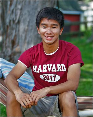 Springfield High graduate Dylan Tan, 18, wears a T-shirt given to him after being accepted into Harvard. His family moved to the United States from Malaysia.
