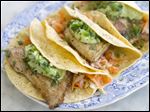  Healthy fish tacos with avocado.