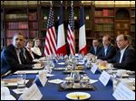  President Barack Obama meets with French President Francois Hollande during the G-8 summit, where discussions included globe-trotting corporate tax dodgers and Syria'ss civil war.
