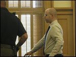  John T. Millinger, a former Wood County Park District ranger, leaves the courtroom after being  sentenced for placing cameras in park restrooms and other locations to film women undressing in the Wood County Courthouse.