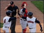  Toledo's Brad Davis greets Argenis Diaz after they both scored on Diaz's 2-run home run.