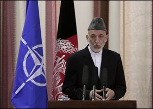 Afghan President Hamid Karzai speaks during a ceremony at military academy on the outskirts of Kabul, Afghanistan, today.