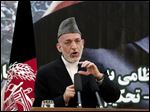  Afghan President Hamid Karzai speaks at a press conference during a ceremony at a military academy on the outskirts of Kabul, Afghanistan, Tuesday.
