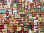  One of two large canvas Community Art Projects designed by Prizm artist Emmanuel Enriquez, and completed by  attendees of the Black Swamp  Arts Festival, is on view at Sam B's in Bowling Green.    