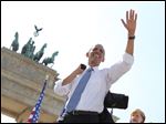 President Obama  waves to spectators before he  delivers a speech in front of the Brandenburg Gate  at Pariser Platz in Berlin, Germany, today.