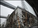  The crippled Fukushima Dai-ichi nuclear power plant is seen through a bus window in Okuma, in Fukushima prefecture in Japan.