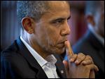 President  Obama listens to French President Francois Hollande during the G-8 summit in Enniskillen, Northern Ireland, Tuesday. Obama is set to speak today at Berlin’s iconic Brandenburg Gate.