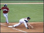  Lehigh Valley's Cesar Hernandez is out running to first after Toledo first baseman Jordan Lennerton makes the putout.