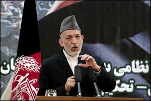 Afghan President Hamid Karzai speaks at a press conference during a ceremony at a military academy on the outskirts of Kabul, Afghanistan, Tuesday.