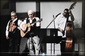 Accordian player Johnny Vassquez, guitarist Baldemar Velasquez, and bassist Ronaldo Revilla, Jr., are to perform at the Songs for Justice fund-raiser scheduled for Saturday at the Farm Labor Organizing Committee headquarters on Broadway.