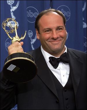 Actor James Gandolfini with his award for outstanding lead in a drama series for his work in 