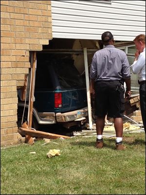 A vehicle drove into the Pinewood Place Apartments building in central Toledo.