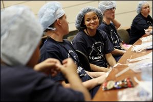 Maia Jones, 13, of Sandusky smiles while participates in a CampMed activity at the Collier Building on the University of Toledo Medical Campus. 