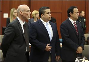 Attorney Don West, left, and jury consultant Robert Hirschhorn, right, stand with George Zimmerman as potential jurors enter the courtroom for Zimmerman's trial in Seminole circuit court in Sanford, Fla., Thursday.