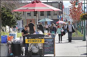 Reindeer dog vendors are set up in downtown Anchorage, a city that offers plenty of cultural, historical, and fun activities for cruise ship passengers who don't want to pay for expensive excursions.