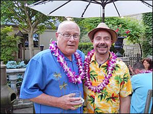 Jeff Ovenden, left, poses with luau co-host Jim Moore at his home to benefit the Young Artists at Work program