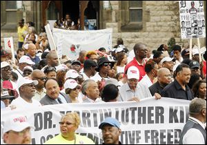 Noted dignitaries including  Martin Luther King, Jr.'s son, Martin Luther King III, second from left with mustache, the Rev. Al Sharpton, Detroit Mayor Dave Bing, in hat, and the Rev. Jesse Jackson participate in the United Auto Workers Detroit Freedom Walk.