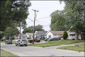 The city is attempting to purchase more than 20 homes along Collins Park Avenue in East Toledo to accommodate a water treatment plant upgrade. So far, only a handful of homeowners have sold. 