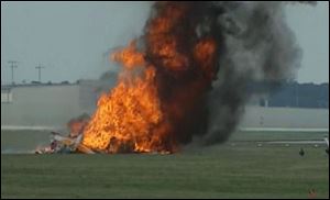 A stunt plane carrying a wing walker crashed then burst into flames at the Vectren Air Show near Dayton, Ohio. 