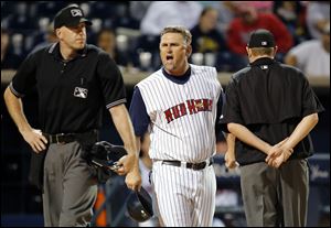 Toledo Mud Hens manager Phil Nevin argues with home plate umpire Jon Saphire during a recent game at Fifth Third Field. The Mud Hens have struggled this year, partly as a result of the Tigers' success and their strong roster.