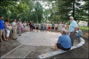 Jim Frye, right, son of the late Catherine Frye and now of Columbia, Tenn., talks about his mother and her efforts to create Olander Park.